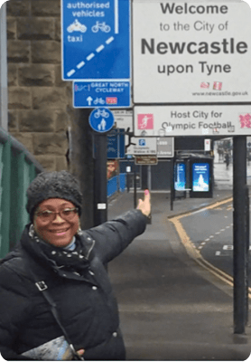 patient Lisa pointing at signs traveling