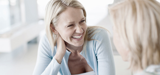 actor portrayal of woman smiling to another woman