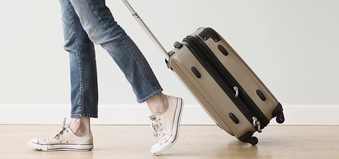 person walking with luggage