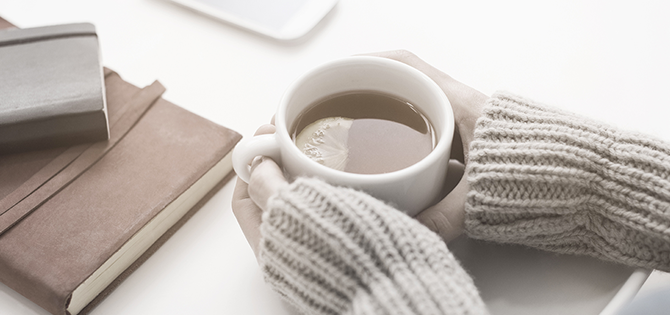 hands holding coffee